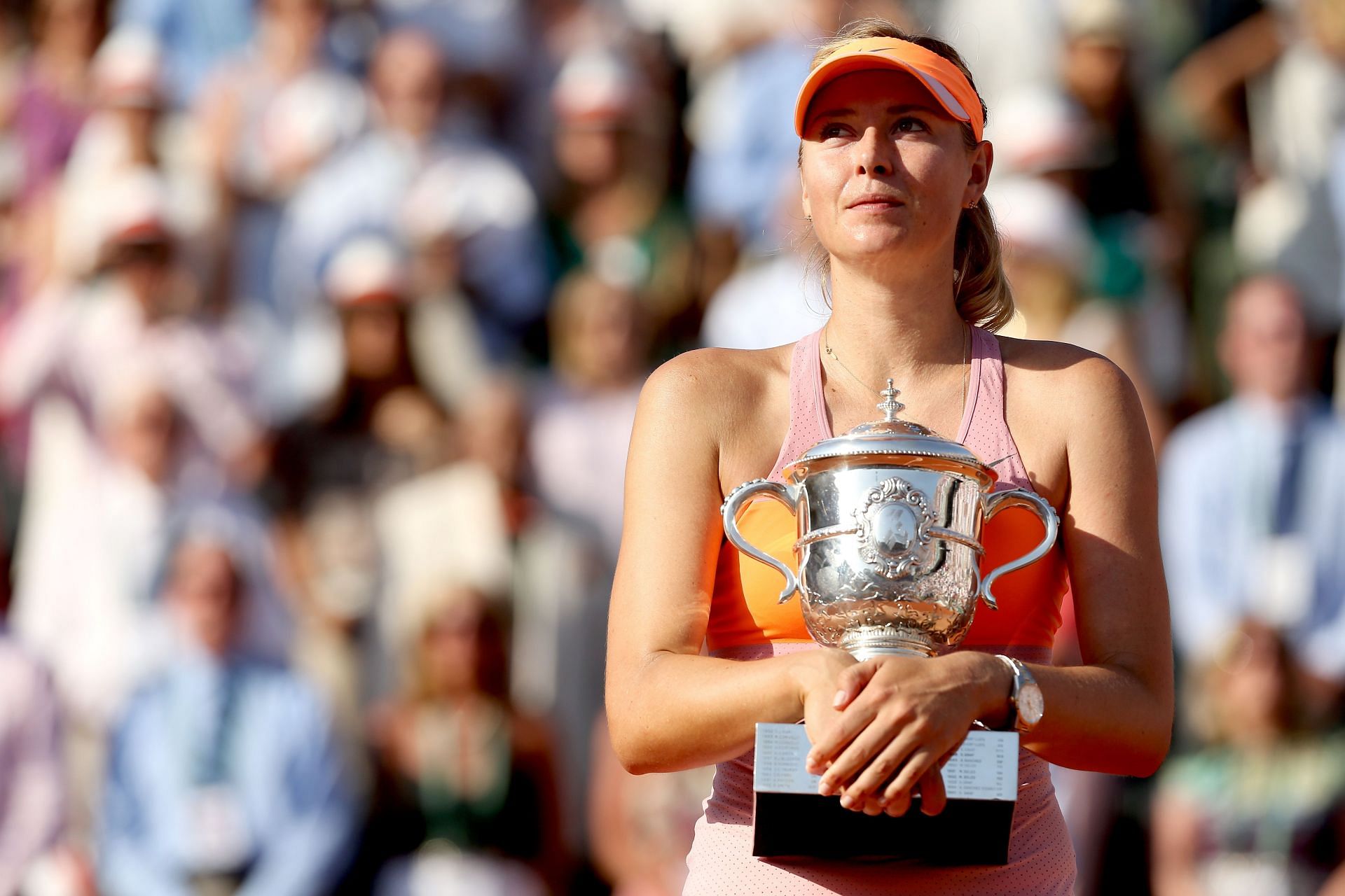 Maria Sharapova pictured with her last Grand Slam title at the 2014 French Open